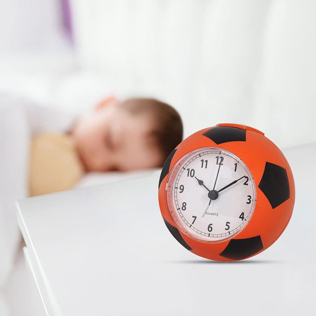 Analogowy budzik w kształcie piłki